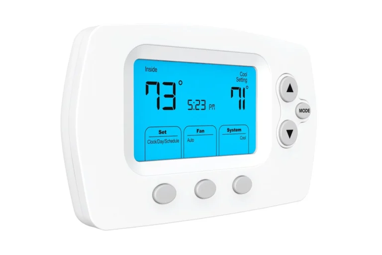 A Digital Thermostat Displaying 73°F Inside Temperature, Set To Cool At 71°F, With Options For Fan, System, And Mode On A Blue Backlit Screen.